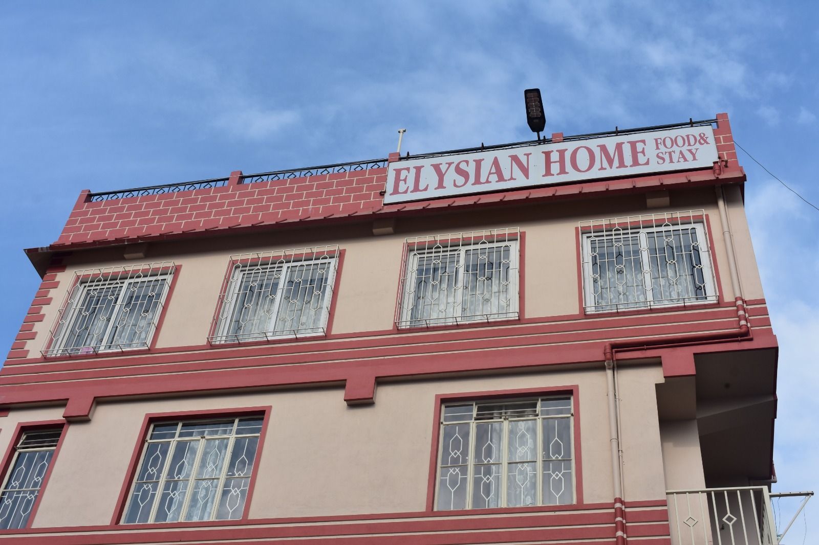 Elysian Home facade with terracotta trim